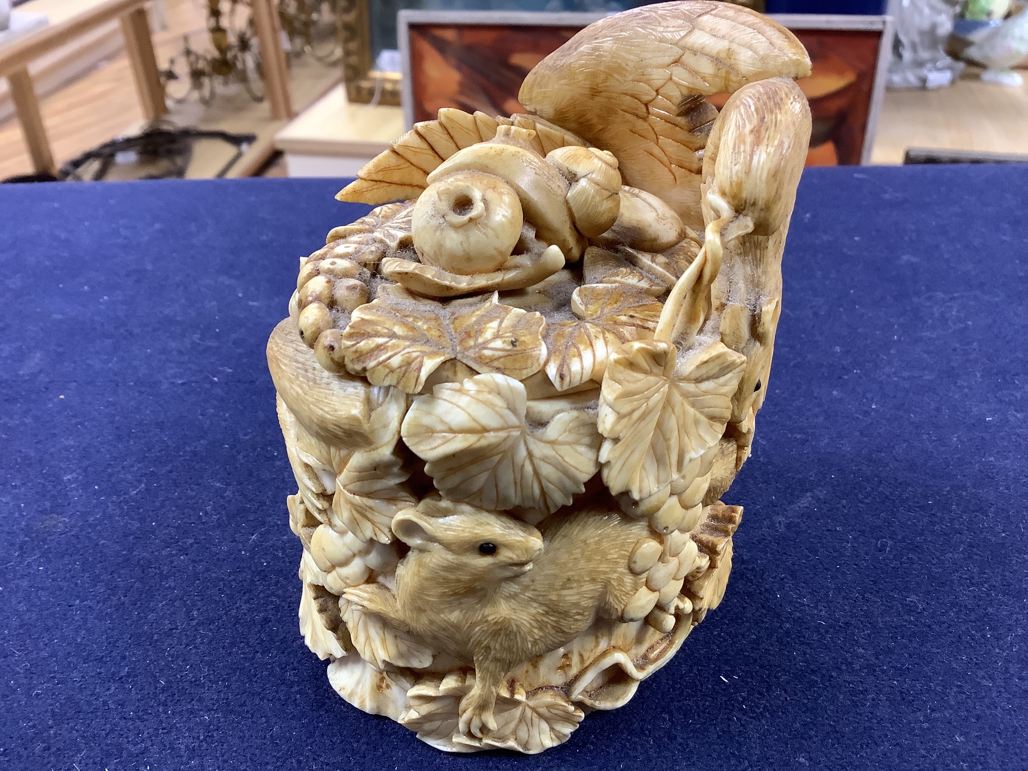 A Japanese ivory box carved with an eagle, frog and squirrels, Meijii period